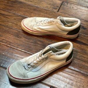 Vans cream, green, and red shoes.